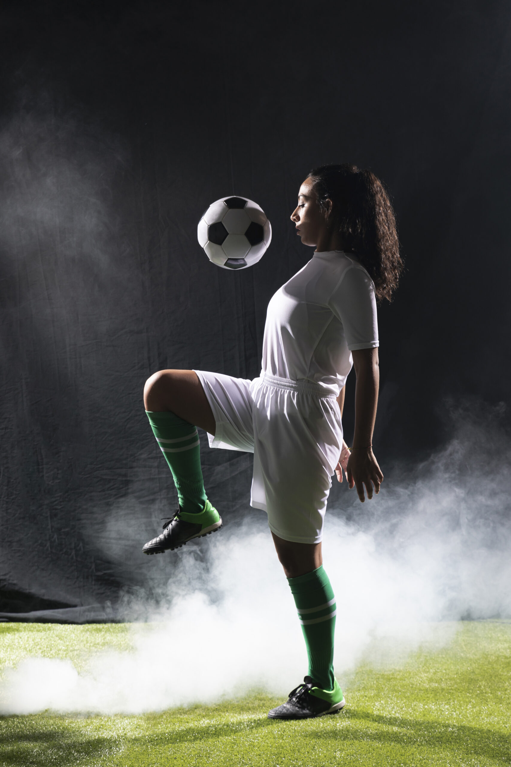 adult-fit-woman-playing-with-football