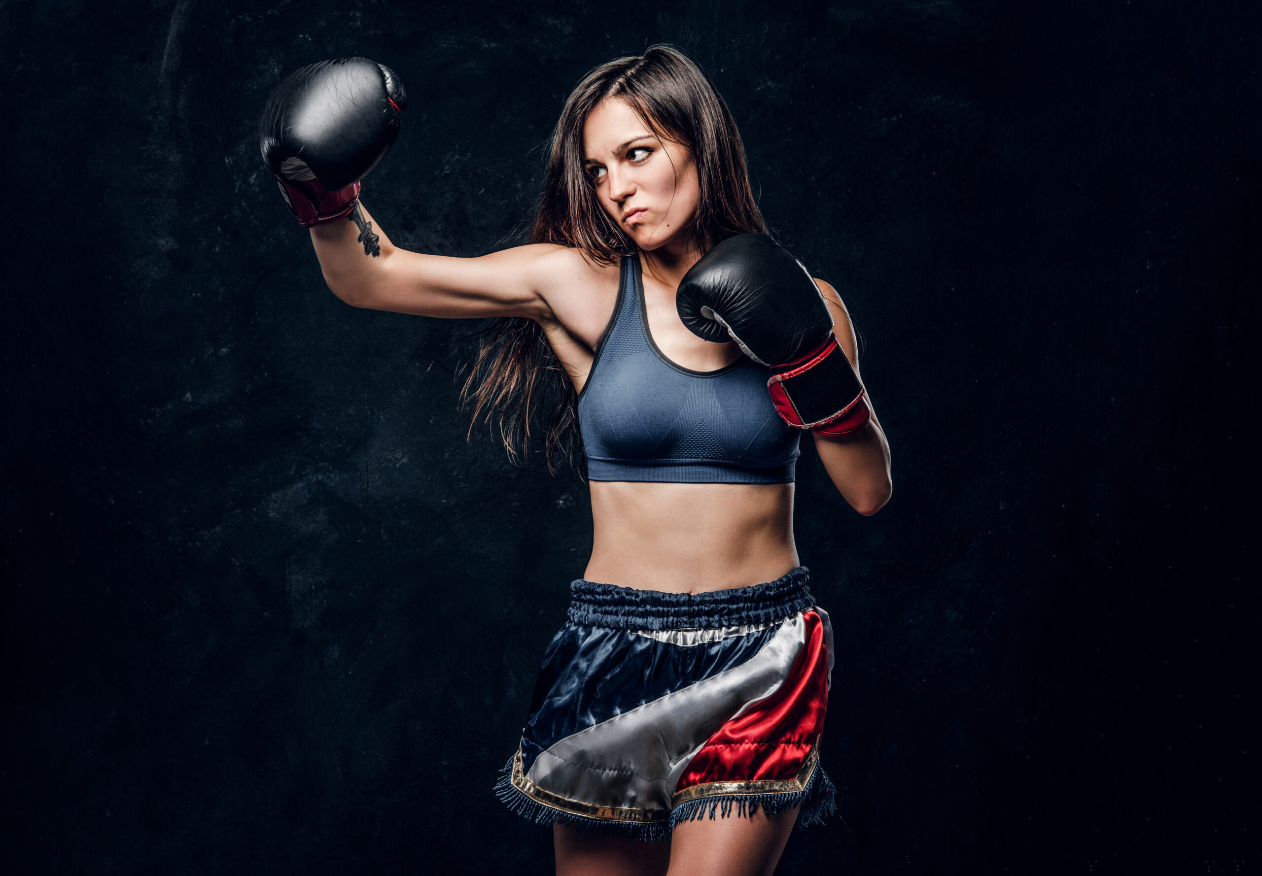 Portrait of pretty professional female boxer
